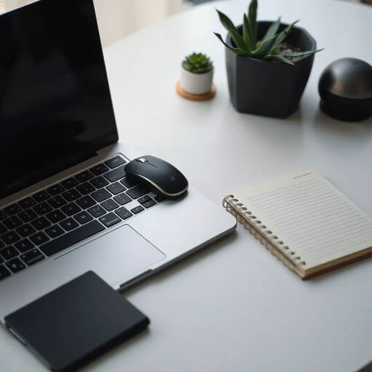 Sleek fashion USB laptop mouse on a tidy desk beside an open laptop
